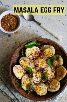 a wooden bowl filled with sliced up bananas next to a small bowl of seasoning