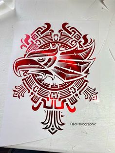 a red and black bird on white paper