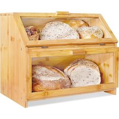 a wooden box filled with lots of different types of bread