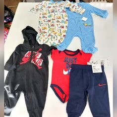 Nike One Piece Black With Hood, Nike Onesie And Sweatpants, Two Little Me Sleepers. Nike One Piece, Nike Onesie, One Piece Black, Kids Nike, Onesies, Kids Shop, Sweatpants, Black And Red