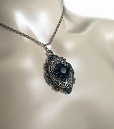 "This richly detailed antiqued silver plated filigree pendant, adorned with dazzling DARK AQUA glass rhinestones that perfectly accentuate a larger jewel in the center. Pendant measures 2 1/4\" tall (including the bail) and 1 1/4\" wide. It is worn on a cable chain in your choice of length and fastens with a lobster clasp. Listing is for necklace ONLY. Matching earrings are listed in our store. This is available in a variety of stone colors in our store, along with matching earrings. If you don' Dark Aqua, 1920's Style, Victorian Necklace, Aqua Glass, Choker Pendant, 1920s Flapper, Filigree Pendant, 1920s Fashion, Bridesmaid Wedding