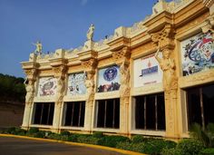 a building with many windows and statues on it