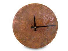 a clock made out of rusty metal on a white background