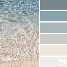 the color scheme is blue and gray, with white waves coming in from the ocean