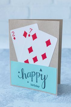 two playing cards with happy birthday written on them