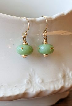 Jade-green donut earrings - Ancient Child Studios Monarch Chrysalis, Lampwork Jewelry, Recycled Jewelry, Earrings Inspiration, Gold Dots, Beaded Jewelry Patterns, Custom Earrings, Handcrafted Earrings, Glass Earrings