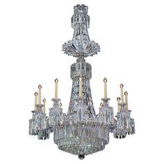 a crystal chandelier with six candles in it