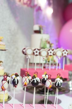 there are many cake pops on the table