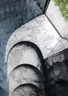 an aerial view of the inside of a building with blue and white tiles on it