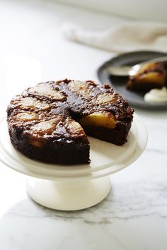 a cake on a plate with one slice cut out