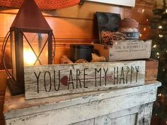 a wooden sign that says you are my happy sitting on top of a fireplace mantel