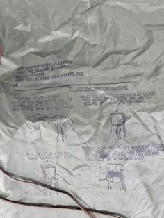 a piece of paper with drawings on it and some wires attached to the side of it