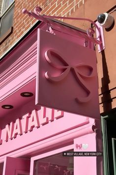 a pink store front with the word natall on it