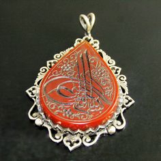 "* Metal: 925 Sterling Silver * Stone: Carnelian Agate * Writings: Hand Engraving * Handmade Silver Design * Collectible Quality-Unique Item * Stone Size: 41x30 mm * Pendant Size: 55x42 mm * Pendant Weight: 19,5 gr(approx) * Stone Back Side Open Writting in Calligraphy: \"Bismillahirrahmanirrahim\" means; \"In The Name of Allah; The Beneficient, The Merciful\" Shipping Service: We are using only expedited and trackable shipping services(mostly Ups) to all over the world. Attention Please: We try Spiritual Silver Intaglio Jewelry, Spiritual Silver Jewelry With Intaglio, Ornate Intaglio Necklace As Gift, Oval Engraved Carnelian Jewelry, Elegant Engraved Carnelian Jewelry, Antique Engraved Carnelian Jewelry, Spiritual Intaglio Jewelry As Gift, Silver Agate Engraved Jewelry, Traditional Engraved Agate Jewelry