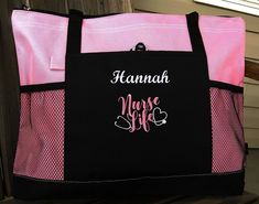 "This roomy personalized tote bag purse has simple style and budget-friendly value! Great nurse appreciation week gift idea! Made to fit a variety of carrying needs, zip up whatever you need in this handy tote bag and be on your way! It even has a place for your pen! Great monogrammed tote for any of the nurses on your list! 600-Denier Polyester Zippered Main Compartment Front Pocket With Pen Loop Mesh Water Bottle Pockets 29 1/2\" Shoulder Straps 4\"w x 14\"h x 20\"L Solid black back Includes N Pink Rectangular Bag For Personalized Gift, Rectangular Travel Bag With Letter Embroidery, Personalized Pink Bags For Everyday, Personalized Tote Bags For Travel, Personalized Pink Bag For Everyday, Customizable Rectangular Pink Bag, Customizable Pink Rectangular Bags, Customizable Pink Rectangular Bag, Customizable Pink Bags For Personal Use