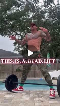 a man is doing deadlifts in front of a pool