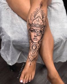 a woman's leg with a tattoo on it