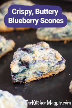 crispy, buttery blueberry scones on a baking sheet with text overlay