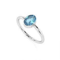 Discover the captivating allure of the LUSTRE & LIGHT Natural Swiss Blue Topaz Handcrafted Stackable Ring, an exquisite piece designed for women and girls who appreciate refined elegance. This stunning ring features a brilliant Swiss Blue Topaz, a gemstone associated with November and December births and the zodiac signs Sagittarius, Capricorn, Scorpio, Gemini, Aries, and Taurus. Set in a sleek bezel of sterling silver, the ring is available in three elegant shapes: Round (4mm), Pear (6x4mm), an Modern Oval Topaz Birthstone Ring, Oval Cubic Zirconia Topaz Ring Birthstone, Blue Oval Sterling Silver Birthstone Ring, Light Blue Blue Topaz Birthstone Ring For Gift, Classic Blue Topaz Birthstone Ring, Round Cut, November Birthstone Jewelry, Swiss Blue Topaz Ring, Zodiac Signs Sagittarius, Swiss Blue Topaz