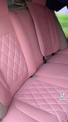 the interior of a pink car is clean and ready for someone to use it in