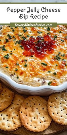 a casserole dish with crackers on the side and text overlay that reads pepper jelly cheese dip recipe