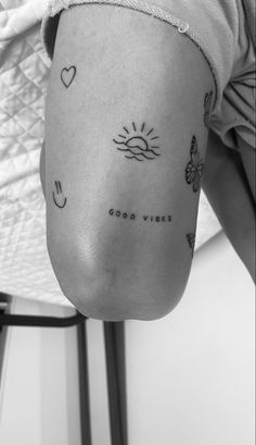 a woman's arm with tattoos on it and the words good vibes written in cursive writing