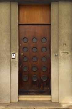 a brown door with circles on it