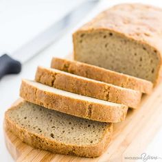 sliced loaf of bread sitting on top of a cutting board