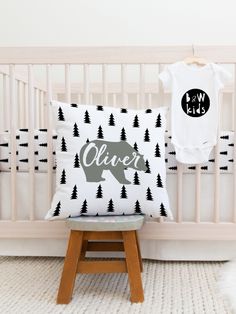 a baby's room with a crib and t - shirt