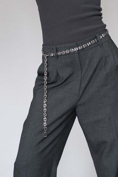 Refined and versatile, the Eris Silver Chain Belt is a statement piece that reflects Lapo Lounge's commitment to timeless design. Made from durable stainless steel, this belt showcases a minimalist yet striking chain-link pattern. Wear it to cinch your waist, pair it with trousers or style it as a necklace for a fresh, fashion-forward approach to accessorizing. Whether you're dressing up or down, the Eris is designed to enhance any ensemble with a touch of modern luxury. The chain is completely adjustable and can be hooked at any point of the belt to achieve the perfect fit. Details:- 100% Recycled Stainless Steel- Carabiner clasp- Resistant to water, sweat, tarnishing and scratches- Handmade in our New York Studio Silver Chain Belt, Silver Gold Necklace, Hair Charms, Streetwear Inspo, Fresh Fashion, New York Studio, Chain Belts, Fit Details, Chain Belt