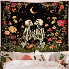 two skeletons sitting in the middle of a field with flowers on it and a full moon behind them