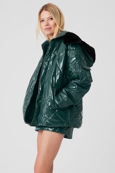 Make a snow day statement in this high-shine puffer jacket. We love the cute quilted finish, the light fill and the wide silhouette that leaves room for layering. Details like elbow patches, a cargo pocket on the arm and a faux-fur-lined hood finish it all off. Wear it with a matching set to walk to your workout or pair with the complementary skirt for a perfect après look. Green Hooded Puffer Jacket With Pockets, Green Down Puffer Jacket With Pockets, Green Nylon Puffer Jacket With Detachable Hood, Green Nylon Puffer Outerwear, Green Hooded Puffer Jacket With Double-lined Hood, Yoga Jacket, Woman Back, Elbow Patches, Alo Yoga