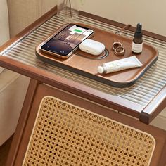 a cell phone and other items on a tray