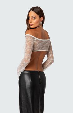 Online only! Have all eyes on you in this super sexy, lace crop top. It's super comfortable, and its sheer fabric will surely make the statement you've been after.


	Crop top
	Off sholder
	Twist front detail
	Full coverage bust
	Sheer lace fabric
	Polyester, Spandex
	Model wears size S
	Model height is 5'9
	Item care: Wash with similar color Visionary Fashion, My Mobile Number, Lace Crop Tops, Twist Front, White Crop Top, All About Eyes, Sheer Fabrics, Sheer Lace, S Models