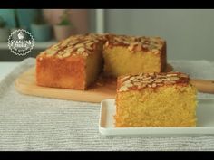 two pieces of cake sitting on top of a white plate next to a wooden spatula