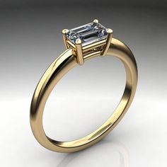 India is a sweet gold ring, with a .5 carat NEO moissanite emerald cut at the center. The stone is set sideways, also called an east west ring. Simple and modern.She has clean lines and in 14k yellow gold, the warm tone of the metal contrasts in a fab fashion with the delicious cool NEO emerald cut center stone. This ring features a near colorless .5 carat emerald cut NEO moissanite at the center. Select 14k white, yellow or rose gold at checkout. Want to see the emerald cut NEO in action? https Engagement Ring East West, East West Ring, Horseshoe Ring, Ring Emerald Cut, Jewellery Rings, Emerald Cut Moissanite, Ring Settings, Mother Rings, Diamond Alternatives