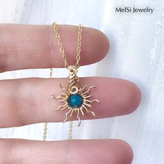 This sun pendant is wrapped and handwoven in 14k gold-filled wire with a beautiful faceted apatite gemstone bead. MEANING Apatite stimulates physical, mental and spiritual growth. Apatite counteracts irritability, listlessness and exhaustion and increases vitality and personal strength. SIZE The pendant is 2.4cm long and 2cm wide. CHAIN For a small, affordable price you can order a matching gold-plated chain with a length of your choice. This is obvious in 'continue selection menu'. If you are i Bohemian Yellow Gold Wire Wrapped Jewelry, Yellow Gold Wire Wrapped Jewelry For Healing, Gold Gemstone Jewelry With Copper Wire, Gold Copper Wire Jewelry With Gemstones, Turquoise Apatite Wire Wrapped Jewelry, Bohemian 14k Gold Filled Wire Wrapped Jewelry, Handmade Apatite Jewelry As Gift, Bohemian Apatite Jewelry For Gifts, Bohemian Apatite Jewelry Gift