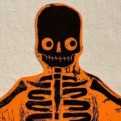 an orange and black drawing of a skeleton