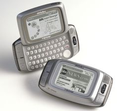 two old cell phones sitting next to each other on a white surface with the same screen