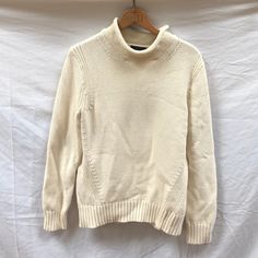 Off-White Knit Roll Neck/Turtleneck Sweater. Never Worn. No Size Specified But Purchase For A Size Small. White High Neck Knit Sweater, Casual High Neck Sweater In Winter White, Casual High Neck Winter White Sweater, Casual Cream Funnel Neck Turtleneck, Classic White Long Sleeve Turtleneck, Casual Cream High Neck Sweater, Casual White Turtleneck For Work, Classic Turtleneck Top In Winter White, Classic Winter White Turtleneck Top