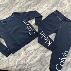 Top Quality Activewear Workout Set From Calvin Klein. Sweatshirt W/ Slit On Hem At Sides Size L Copped Pant With Drawstring Size L Color Blue Fleece Lined Formal Romper, Sheer Black Tights, Calvin Klein Sweatshirt, Calvin Klein Euphoria, Long Sleeve Sweater Dress, Klein Blue, Calvin Klein Woman, Zip Up Sweater, Black Romper