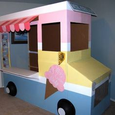 a child's ice cream truck bed made out of cardboard