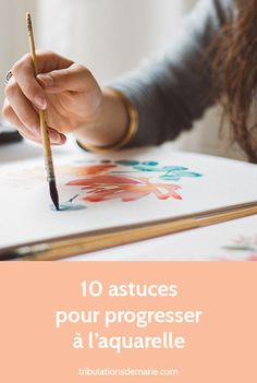 a woman is holding a pencil and drawing on paper with the words 10 astuces pour progresser a l'equarrelle