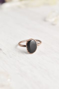 "Handmade with raw materials and intention, this raw black obsidian ring awakens the wild woman. Created with natural stones, each one organically different and individually unique just like you. Embedded in electroformed copper, inspiring a textured, earthy style. The natural obsidian stone ring invites you to embrace your intuitive nature. Explore the forests, climb the mountains, and swim in the rivers. \"Letting go is where life begins.\" Trust your instincts and walk into the wild. Crystal Black Obsidian Jewelry, Black Obsidian Ring, Copper Electroforming, Obsidian Jewelry, Obsidian Ring, Healing Crystal Ring, Earthy Style, Raw Gemstone Jewelry, Raw Gemstone Ring