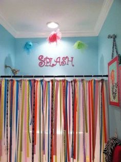 colorful streamers are hanging from the ceiling in front of a sign that says splash