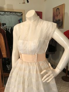 "For Sale:   VTG 1940's Ivory sheer organdy over a strapless ivory satin.  Full skirt, strapless satin underdress with a sheer organdy embroidered overdress.  Nipped waist, full gathered skirt. Fabulous neckline !  Little cap style sleeves.   Side zipper works just fine.   An apricot ribbon accent at waist.   CONDITION: Excellent Vintage Condition - minty !   MEASUREMENTS of DRESS:  chest: 35\"  waist: 24\"  Length: 42\" hips: Full Minty vintage condition !" Cream Dress With Sheer Bodice For Evening, Vintage White Dress With Fitted Bodice For Vintage Events, Vintage Organza Summer Dress, 1950s Style Vintage Wedding Dress, Feminine Cream Vintage Party Dress, Vintage Organza Dress For Spring, Vintage Spring Organza Dress, Spring Vintage Organza Dress, Vintage Organza Prom Dress