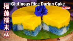 there is a yellow and blue cake with flowers on the top that says glutinous rice durian cake