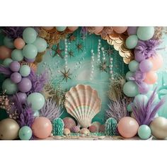 an ocean themed backdrop with balloons and seashells