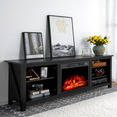 an entertainment center with a fire place and pictures on the top shelf in front of it