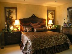 a large bed sitting in a bedroom next to two lamps